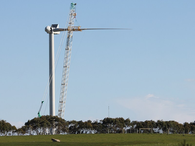 First of two wind turbines being installed with two of three blades also in place.