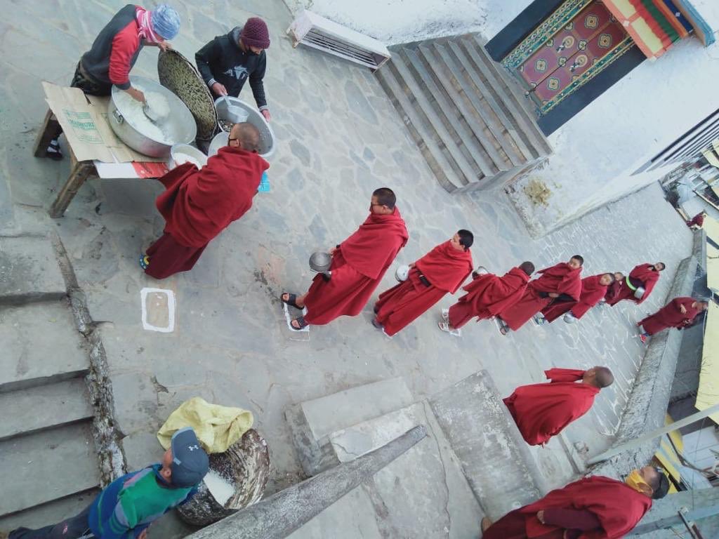 Monks in Tawang Monastery maintain physical distancing.