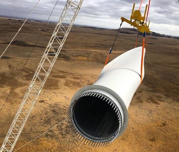 First turbine installed at the farm. Picture shows the blade being hoisted to be fitted.