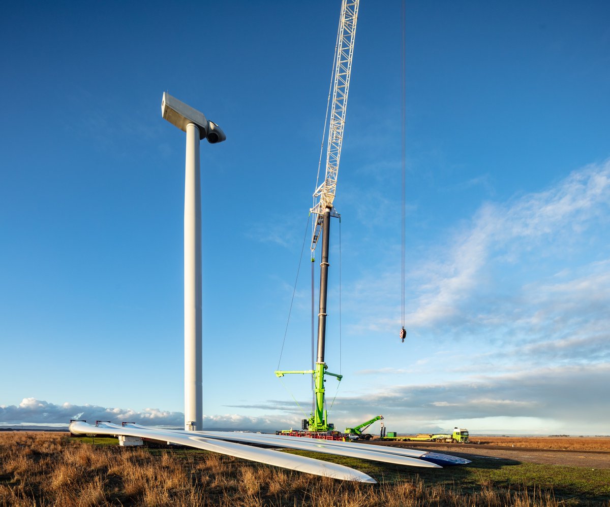 Construction work continues at site - pictured here are blades being hoisted to the top of the turbine.