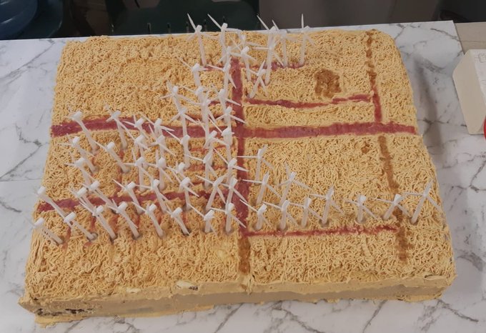 Construction of all 61 turbines now completed. Project team marks the event with an appropriate cake!