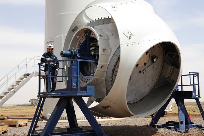 direct and indirect jobs will be created during construction. Photo show Sam, one of the technicians onsite, during the turbine assembly.