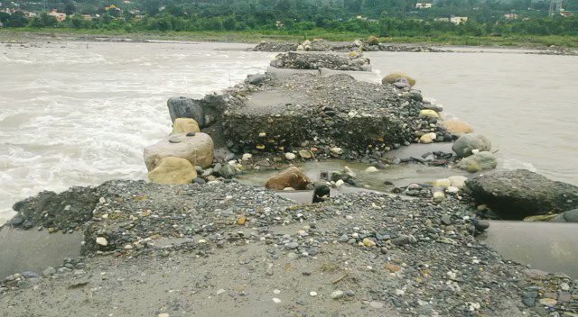 Illegal mining bridge on Yamuna in Vikas Nagar not removed despite many appeals. With rise in river levels, its wearing away now and bound to cause flood disaster if it rains heavily.