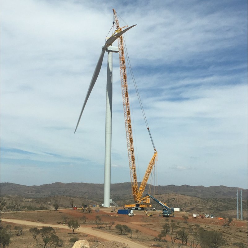 Blades being hoisted and fitted in place.