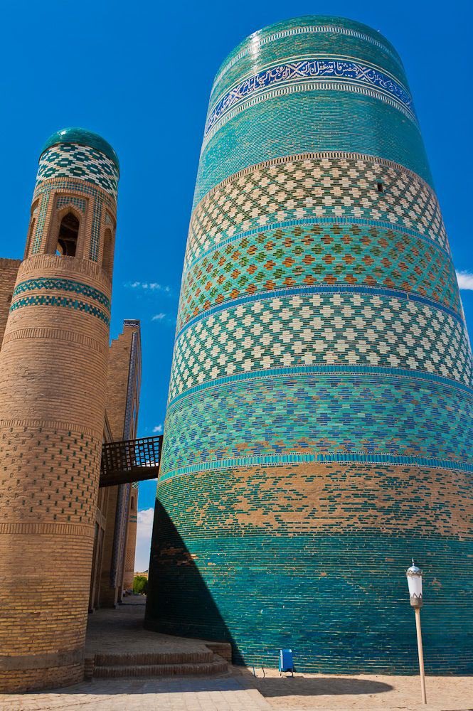 Kalta Minor Minaret, Khiva, Uzbekistan. One of the last great blue buildings in the Khanate of Khiva was Kalta Minor. This had to be the tallest structure in Khiva and in the whole of Central Asia. Works ended abruptly in 1855, leaving this beautiful minaret unfinished.