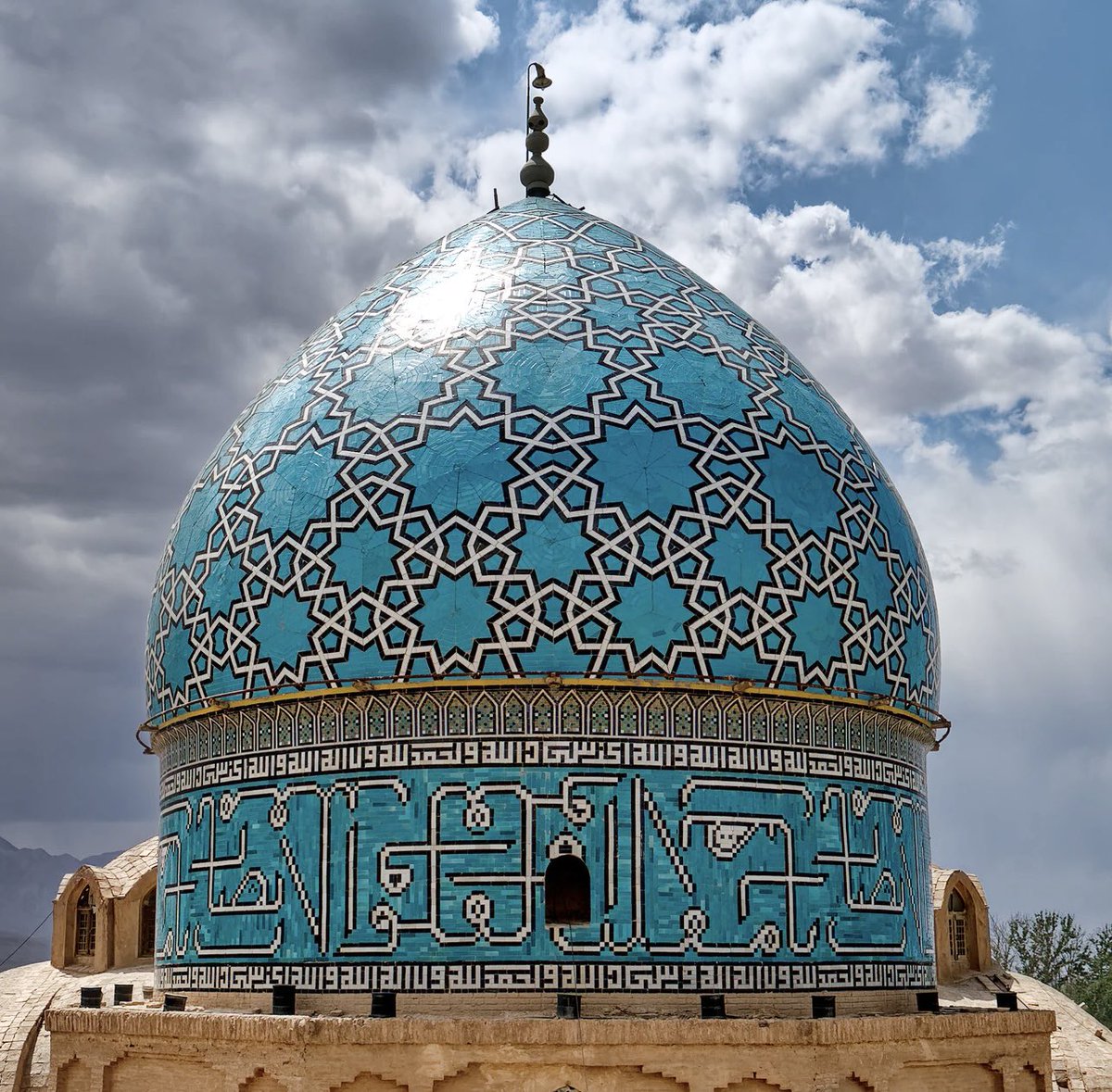 Mausoleum Shah Nematollah Vali, Mahan, Kerman, Iran. Shah Nematollah Vali was a renowned Iranian mystic and poet. He died in 1431 aged over 100. In 1436 a shrine was erected in his honour, with distinct beautiful turquoise blue tiles.