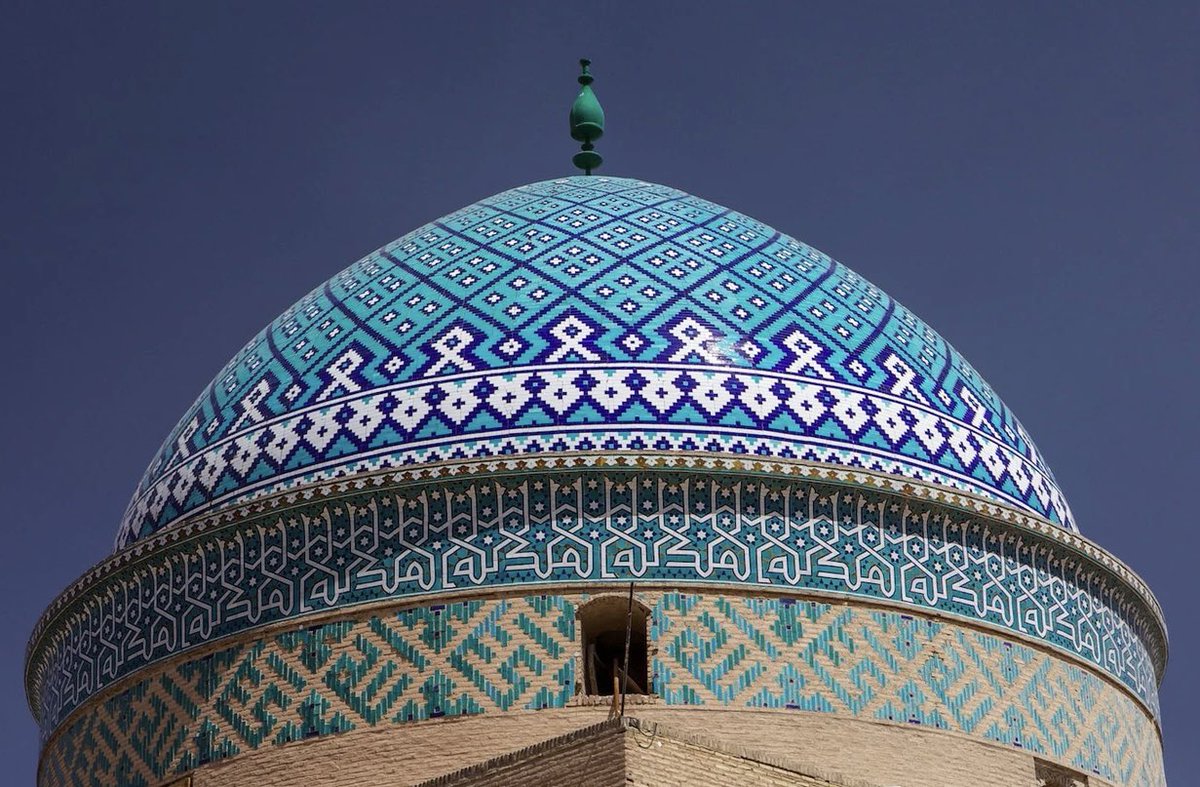 Yazd Jame Mosque, Iran. Built in the 12th century. A magnificent double-shell turquoise dome crowns the mosque. The entrance of the mosque is decorated with Quranic verses, slates outlining government laws, endowment deeds and reports of repair work on the structure.